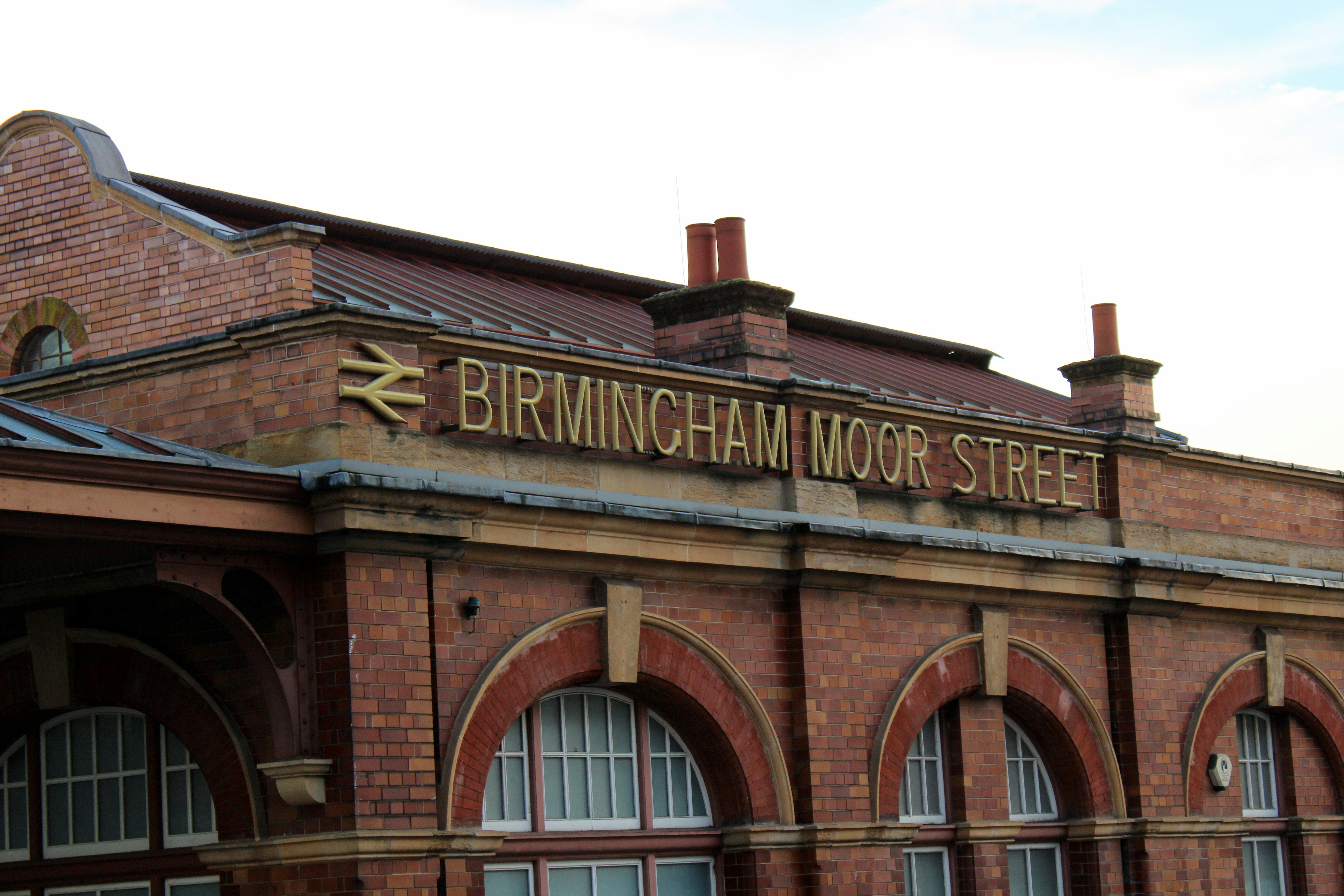 A large brick building with a clock tower on top of it